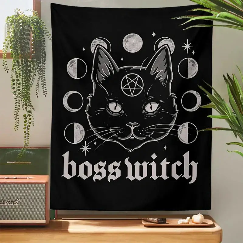 Black tapestry featuring a stylized cat with glowing eyes and moon phases with bold boss witch text for cat witchcraft black decorbites