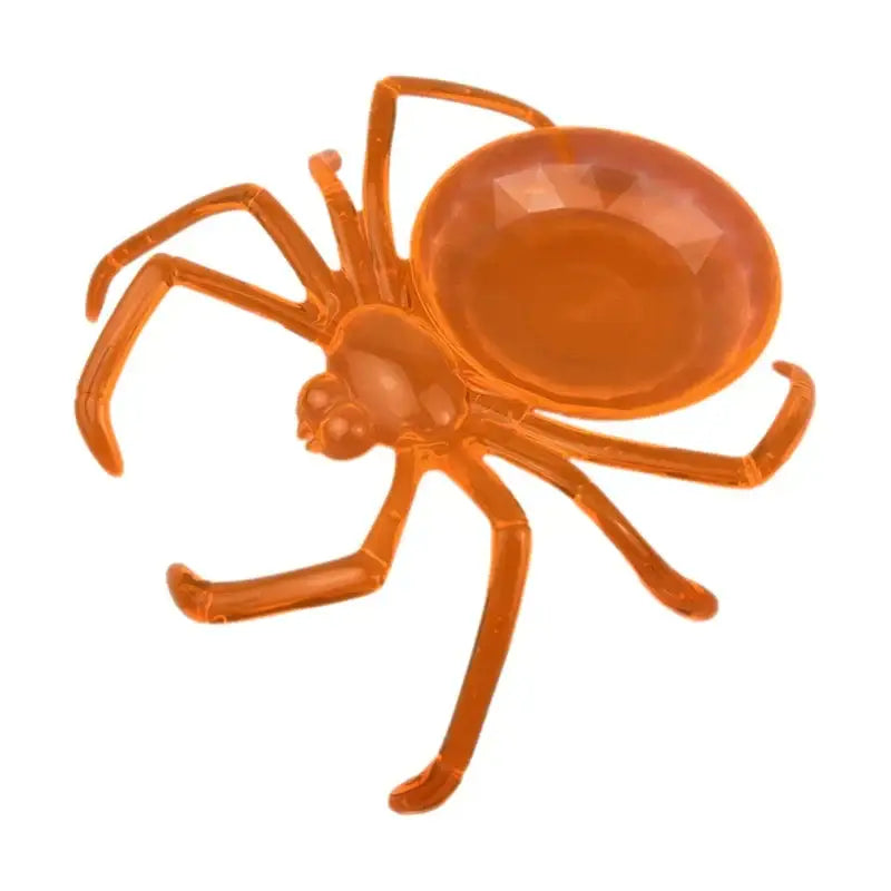 Transparent orange plastic skull spider tray with faceted gemstone abdomen for gothic dining room storage plate