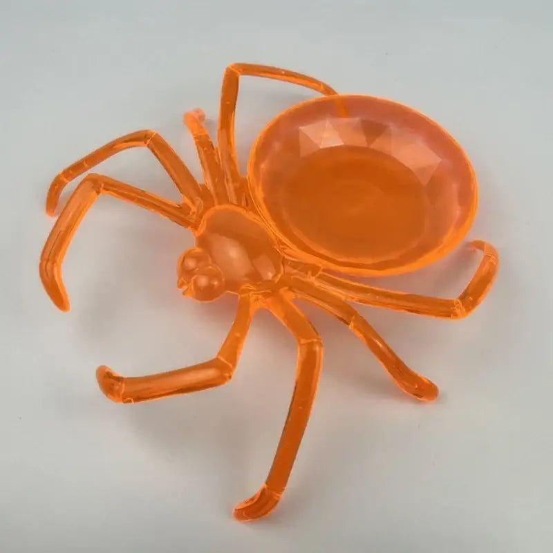 Transparent orange plastic skull spider tray with faceted gem abdomen for gothic storage plate and candy dish