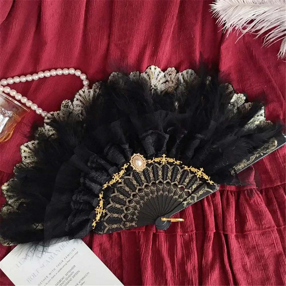Elegant black lace fan with gold filigree detailing and central pearl accent for gothic gold filigree lace fan decorbites elegant gemstone handle
