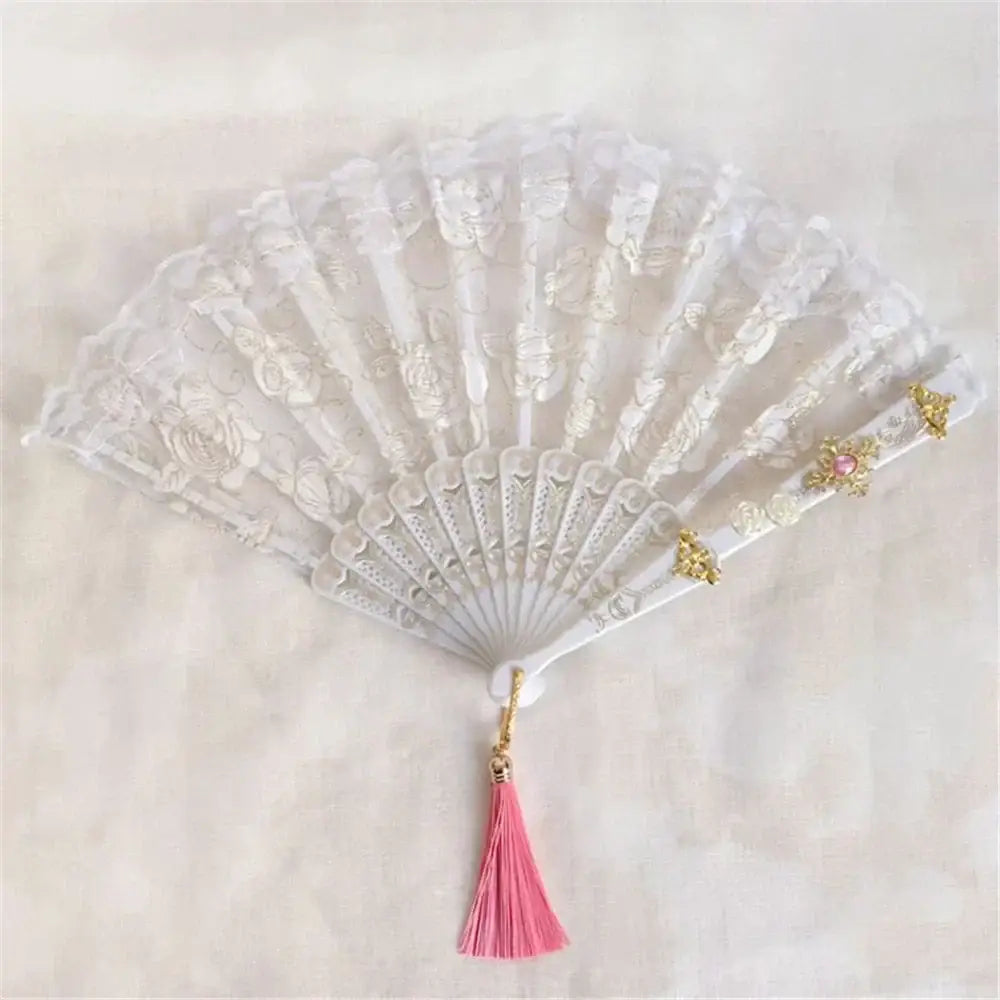 Elegant white lace fan with gold embellishments and pink tassel featuring decorbites elegant gemstone handle for gothic decor