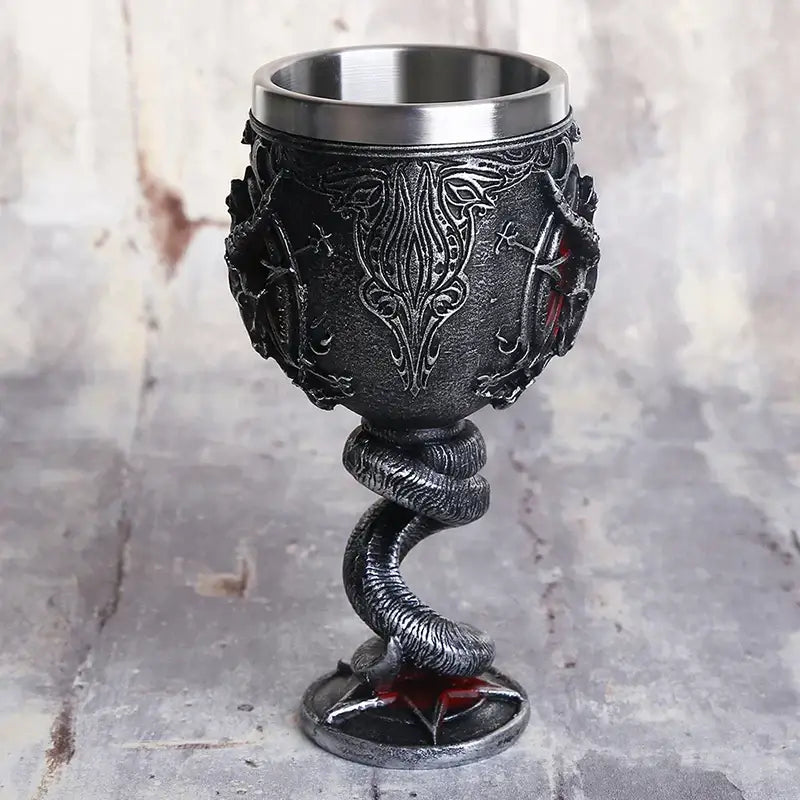 Darkly ornate gothic silver baphomet wine glass with stainless steel rim base and coiled serpent stem design