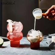 Clear gourd shaped glass cup set featuring bulbous clear tumblers with wooden handles for kitchen drinkware use