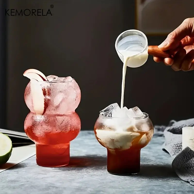 Clear gourd shaped glass cup set featuring bulbous clear tumblers with wooden handles for kitchen drinkware use