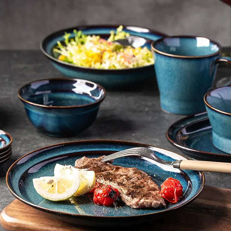 Beautiful blue ceramic dinnerware dish with speckled glaze and dark gold rim perfect as a ceramic bowl