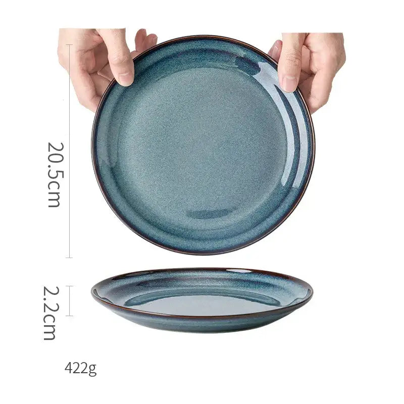 A sleek glazed ceramic bowl with gradient blue finish gold rim dinnerware dish for elegant dining room use