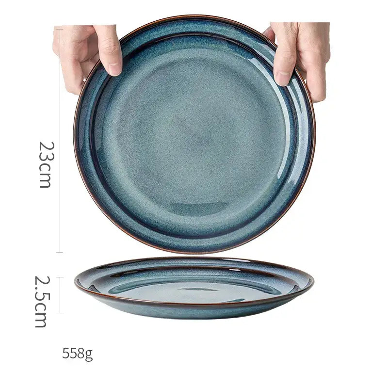 A beautiful blue ceramic dinnerware dish features a 23cm ceramic bowl with gradient glaze and subtle brown rim