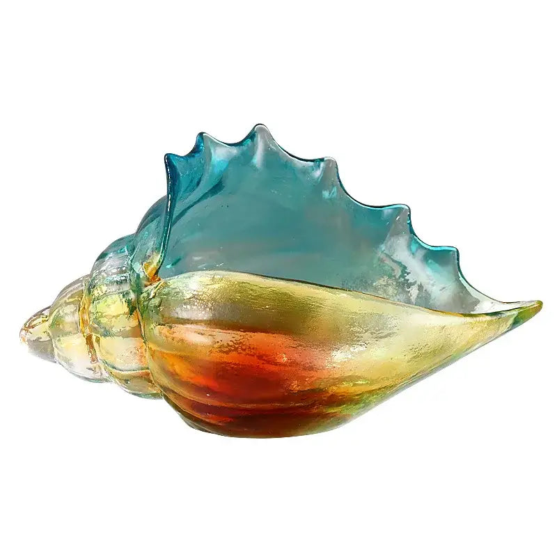A translucent glass key tray with gradient teal amber and gold hues from decorbites conch glass handicrafts