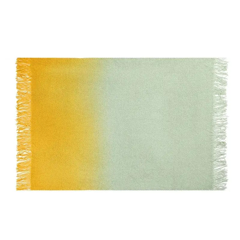 A soft knit blanket with a decorbites gradient pineapple grid pattern and warm yellow to mint green gradient colors