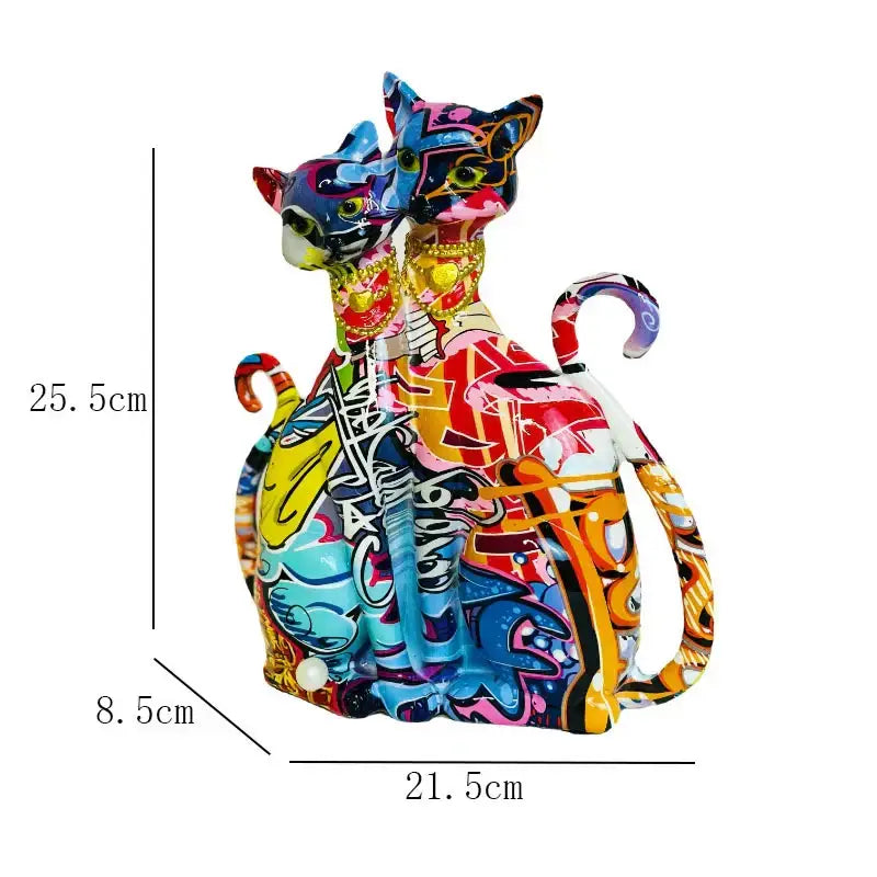 Vibrant graffiti-style ceramic decorbites cat couple sculpture with bold colors and metallic accents for living room decor