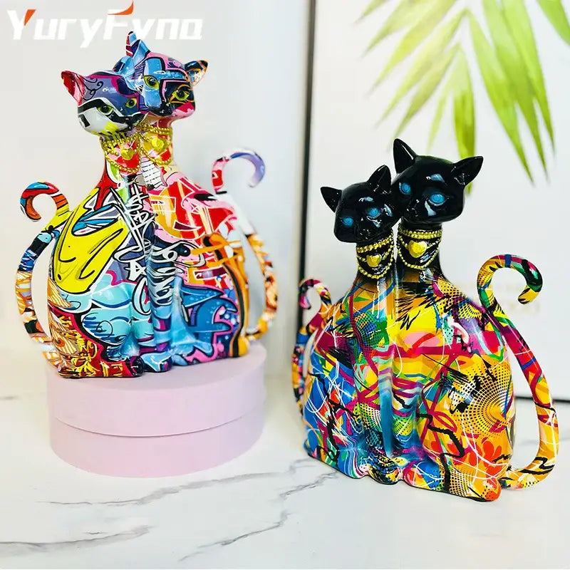Vibrant decorbites cat couple sculpture featuring graffiti-style painted cat figurines with glossy finishes for living room decor