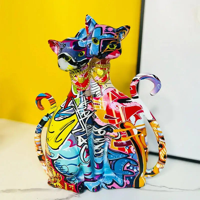 Vibrant graffiti-style ceramic cat couple sculpture with bold colors and intricate designs for decorbites cat decorbites cat couple