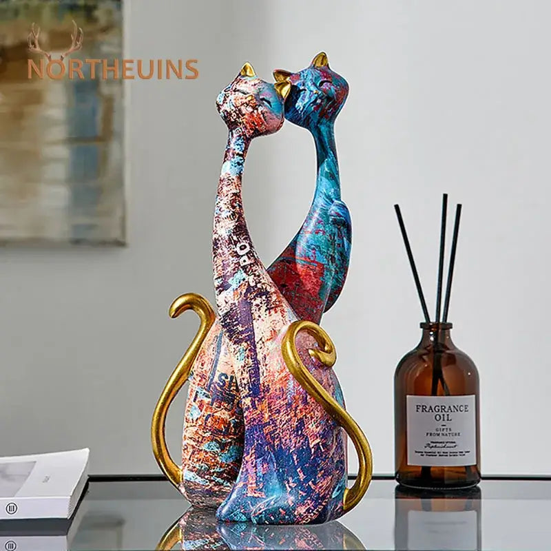 Vibrant abstract painted ceramic cat figurine with gold-tipped tails and ears for decorbites cat lovers resin decor