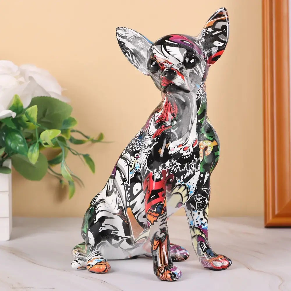 A vibrant graffiti colorful chihuahua resin statue in black white red and orange for decorbites bulldog chihuahua decor