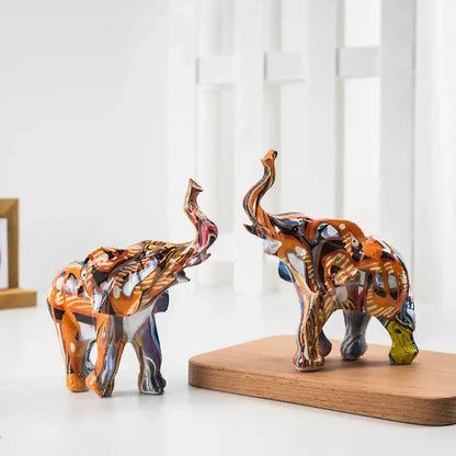 Two vibrant graffiti colorful elephant resin figurines with glossy orange and multicolored patterns for living room decorbites decor