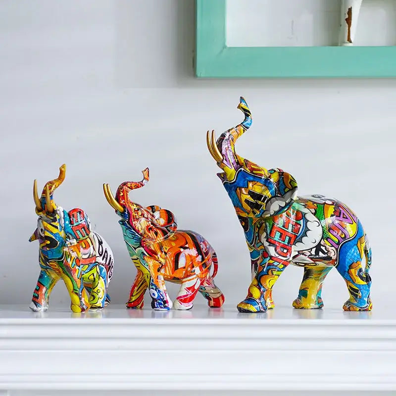 Three vibrantly painted decorbites elephant resin figurines with comic book design for living room home decor