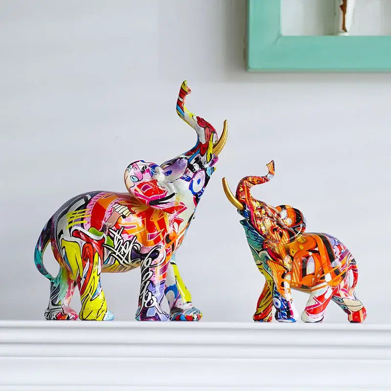 Two vibrantly painted graffiti-style decorbites elephant resin figurines with gold-trimmed tusks for living room decor