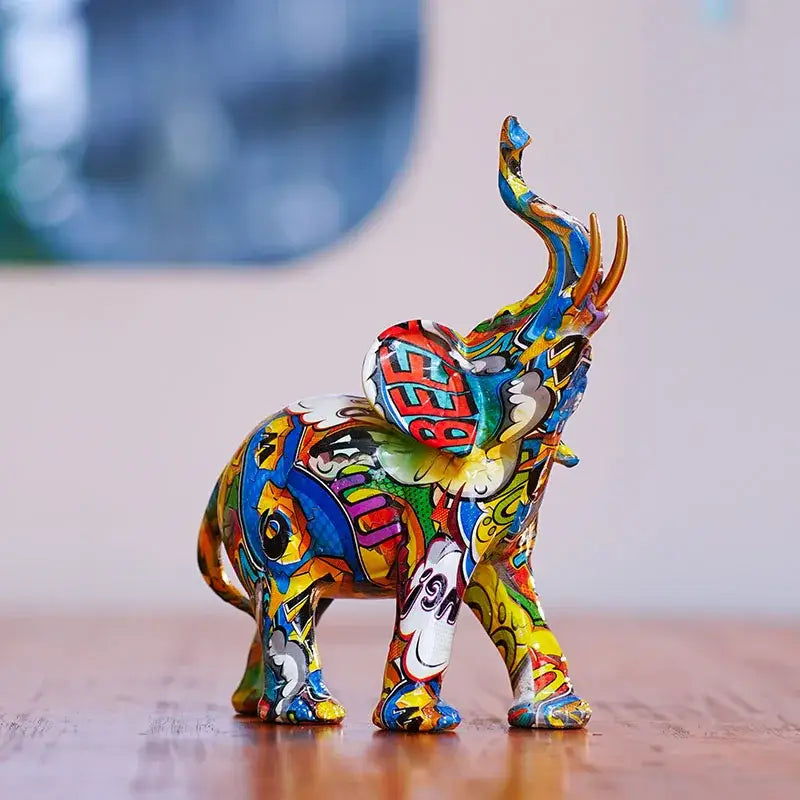 Vibrant graffiti-style decorbites elephant resin figurine with glossy finish in blue yellow red and green for home decor