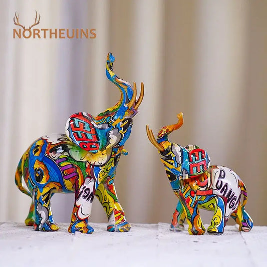 Vibrantly painted graffiti elephant resin figurine with metallic gold tusks by decorbites for living room home decor