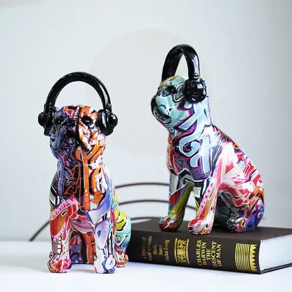Two vibrant graffiti resin bulldog headphone figurines with black headphones for living room decor