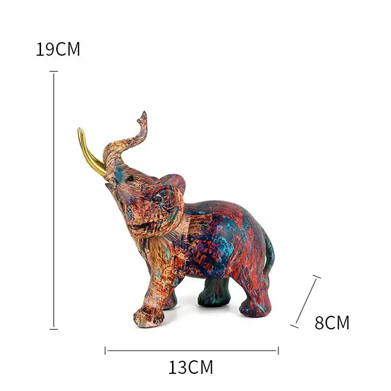 A vibrant multicolored graffiti resin elephant sculpture with a golden horn by decorbites for living room decor