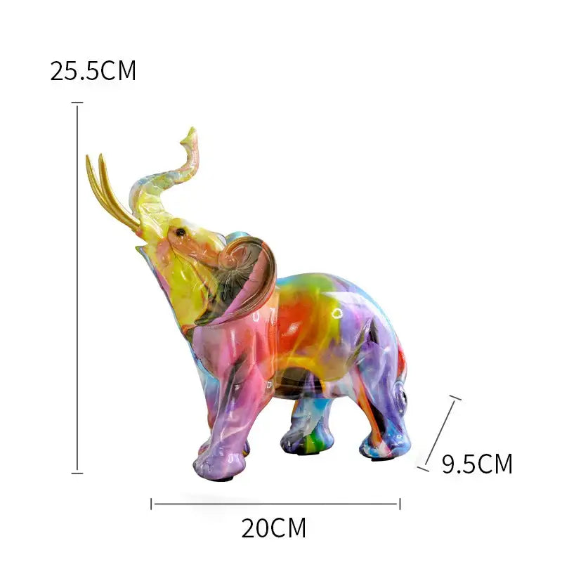 A vibrant translucent glass decorbites elephant sculpture with rainbow gradient and gold-trimmed tusks for living room art