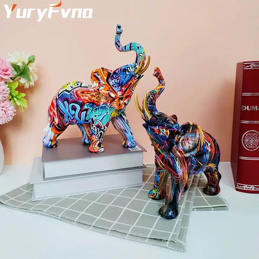 Vibrant graffiti resin elephant sculpture with bold swirling colors and dynamic patterns decorbites elephant decorbites elephant sculpture