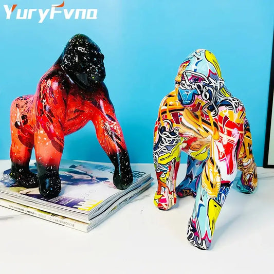 Two vibrant graffiti street art gorilla sculptures with glossy resin finish ideal for living room decor by decorbites