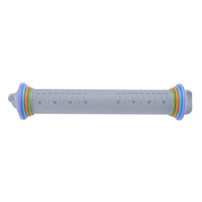 A translucent gray decorbites adjustable silicone rolling pin measuring cup with colorful rings and inch markings