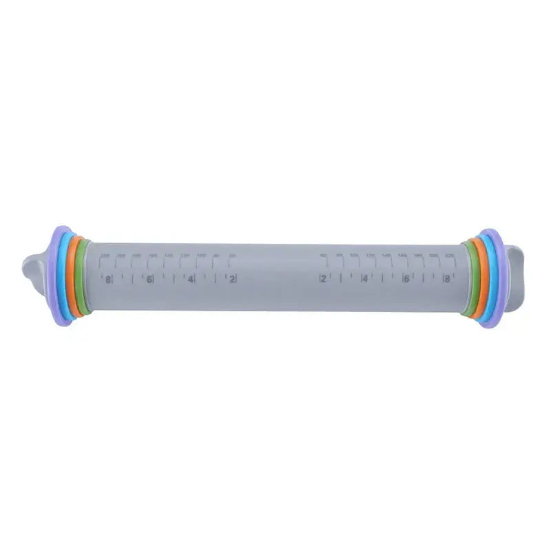 A translucent gray decorbites adjustable silicone rolling pin measuring cup with colorful rings and inch markings