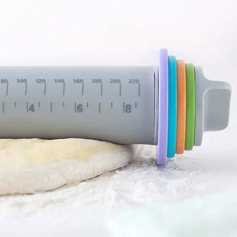 Gray plastic rolling pin with colorful silicone rings and measurement markings decorbites adjustable silicone rolling pin