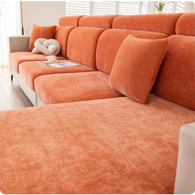 Orange corduroy sectional sofa with matching throw pillows featuring gray and beige chenille universal sofa cover