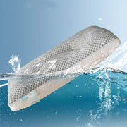 Gray and beige honeycomb memory foam cooling pillow with decorbites ice rayon partially submerged in water