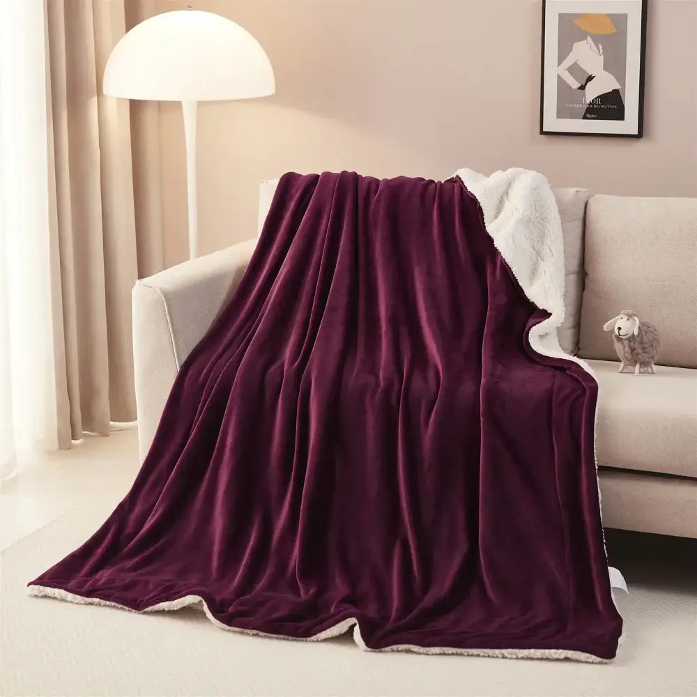 Plush deep purple sherpa twin blanket with soft white sherpa lining reversible for bedroom throw use