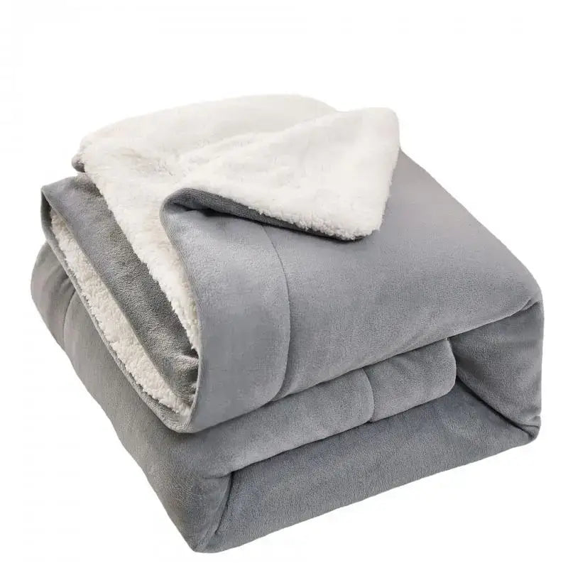 Gray and white reversible sherpa twin blanket with soft white sherpa lining for cozy bedroom throw use