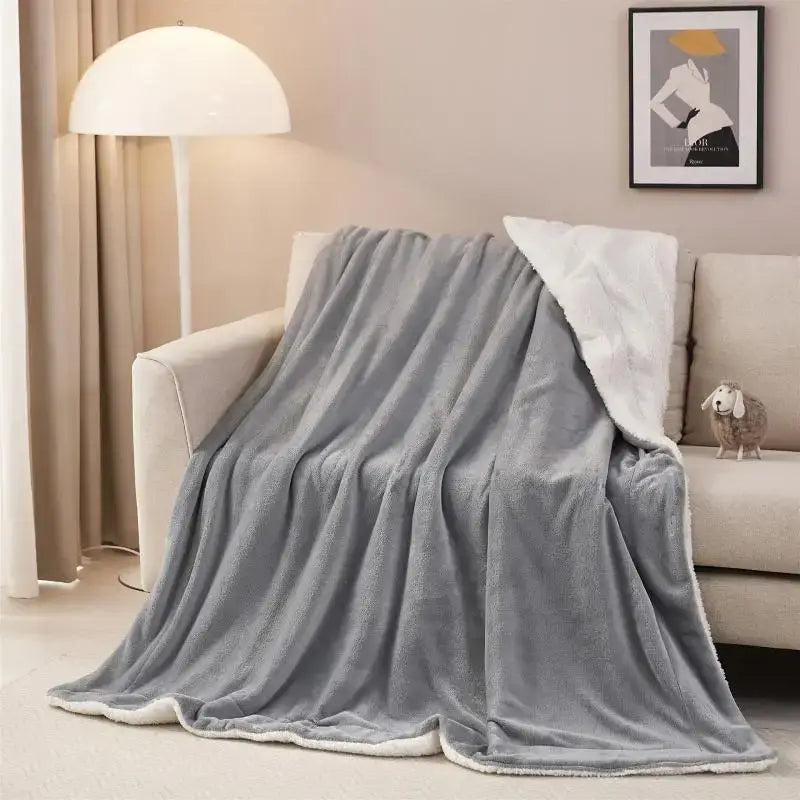 Gray and white reversible sherpa twin blanket with soft textured exterior and white sherpa lining for bedroom throw