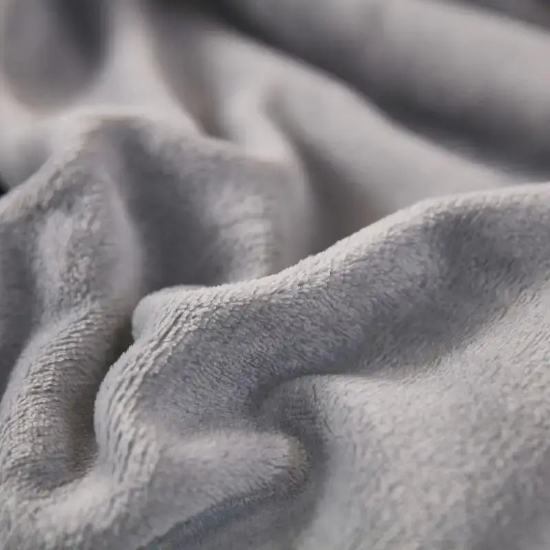 Soft gray plush sherpa twin blanket with textured fuzzy surface reversible with white sherpa twin bedroom throw