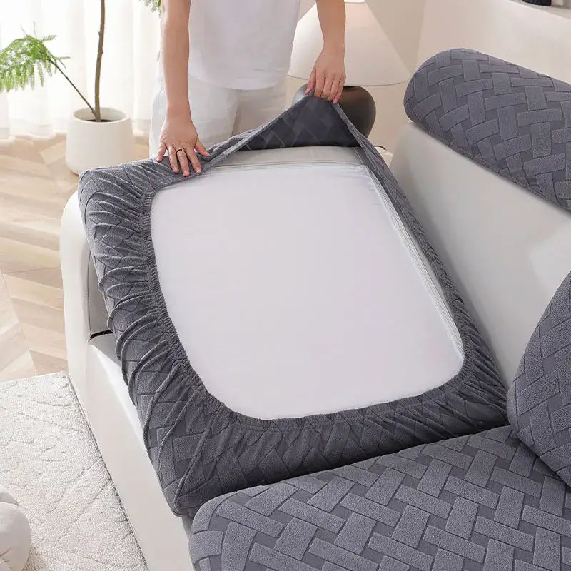 Gray and white woven elastic sofa slipcover with quilted texture for living room use