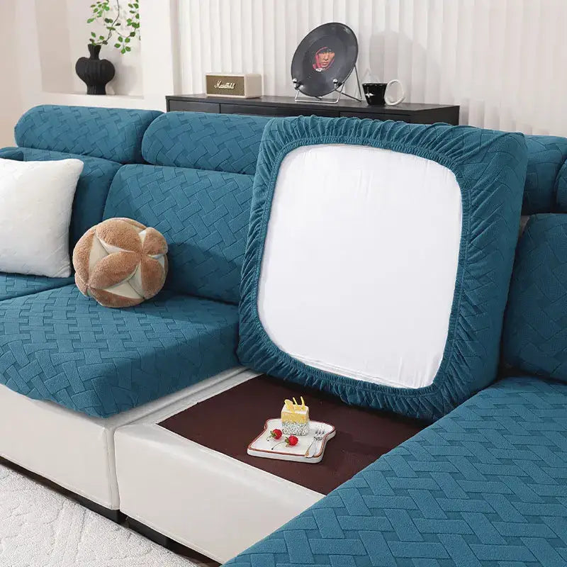 Teal woven fabric sofa cover with white central panel and elasticated edges for living room use