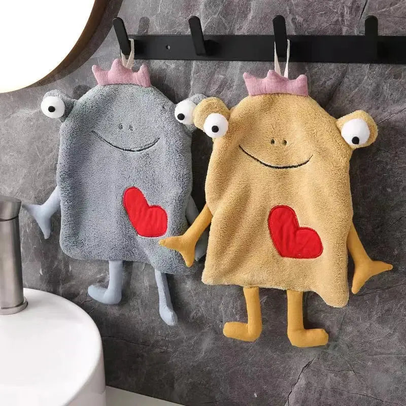 Two plush gray and yellow frog design hand towels with pink crown and red heart patches for bathroom decorbites frog design