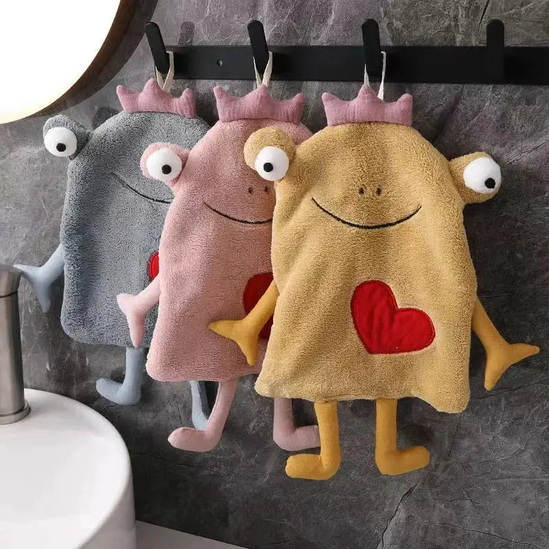 Plush gray and yellow frog design hand towel with cartoon monster decor and red heart patches for bathroom use by decorbites