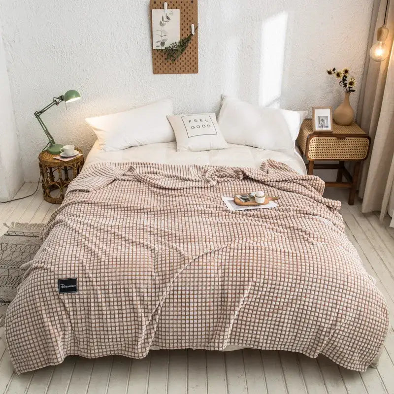 Beige and cream checkered fleece bed blanket with soft textured surface for gray plaid coral fleece bedroom use