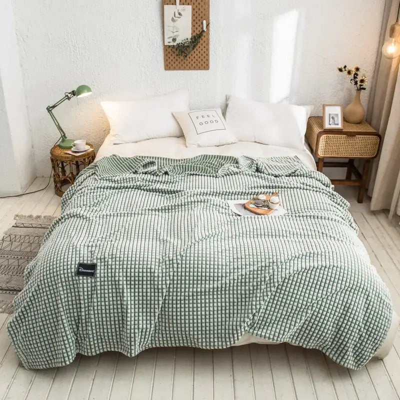 Green and white checkered duvet cover with soft textured fabric finish shown alongside gray plaid coral fleece bed blanket