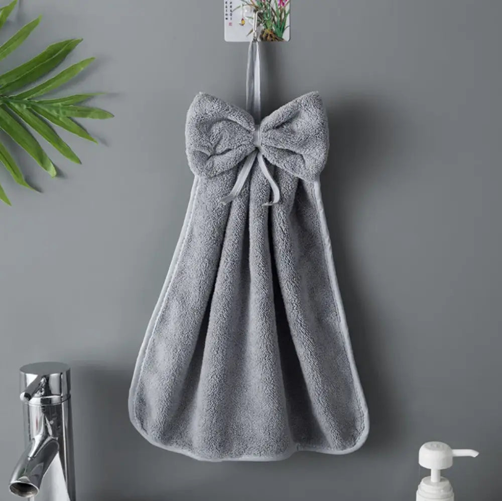 Gray hand towel with bowknot coral velvet design hanging on hook for kitchen cleaning by decorbites bowknot coral