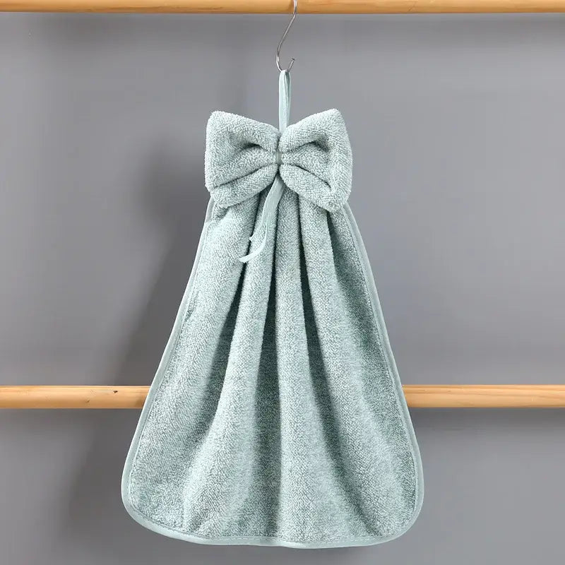 A soft light green bowknot coral velvet hand towel with plush texture from decorbites bowknot coral collection