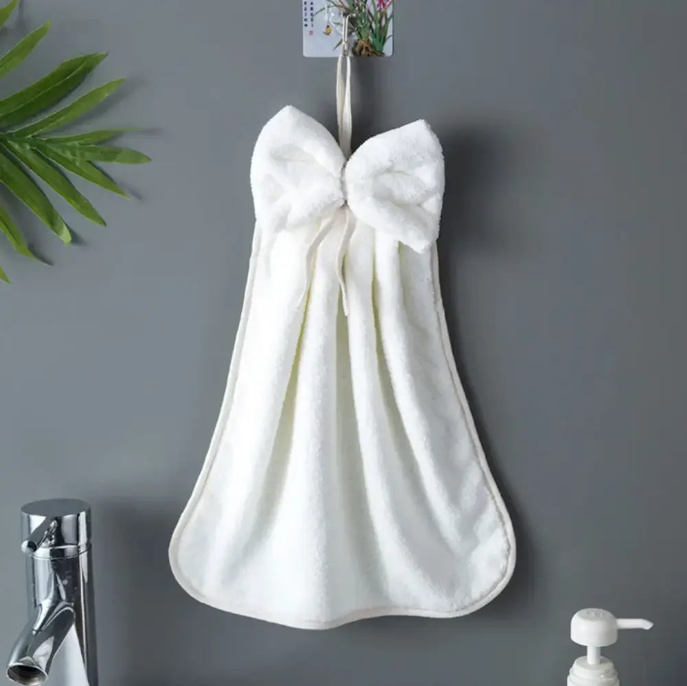 White plush hand towel with a fluffy bowknot coral velvet hanging near sink decorbites bowknot coral cleaning cloth