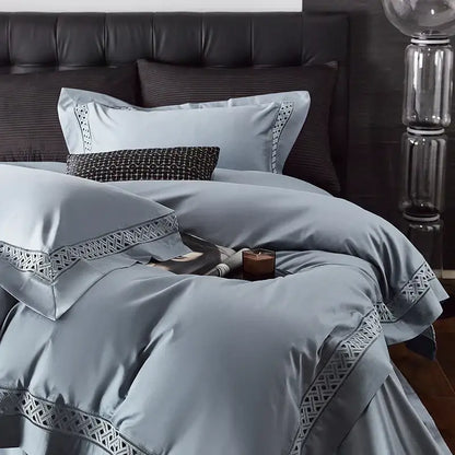 Light blue satin bedding set with intricate geometric embroidery designed as an egyptian cotton hotel bedding set