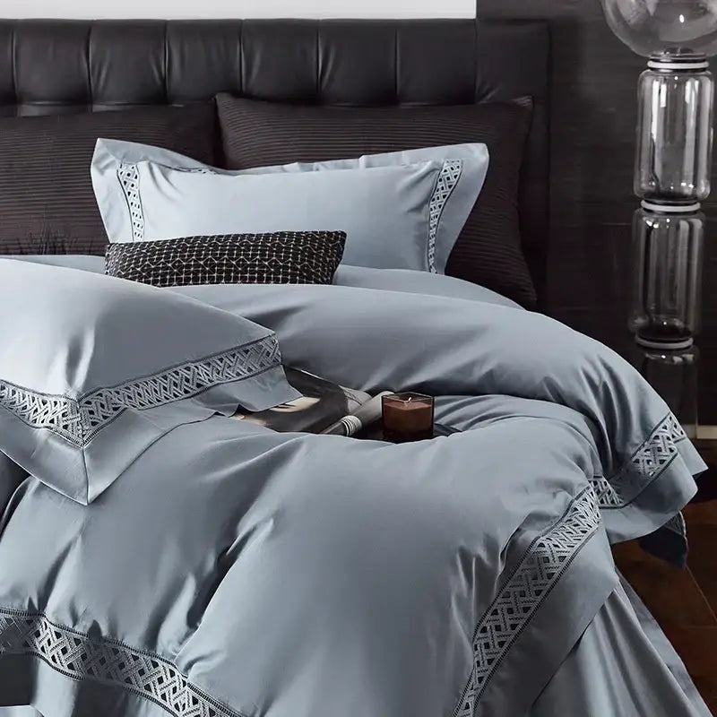 Light blue satin bedding set with intricate geometric embroidery designed as an egyptian cotton hotel bedding set
