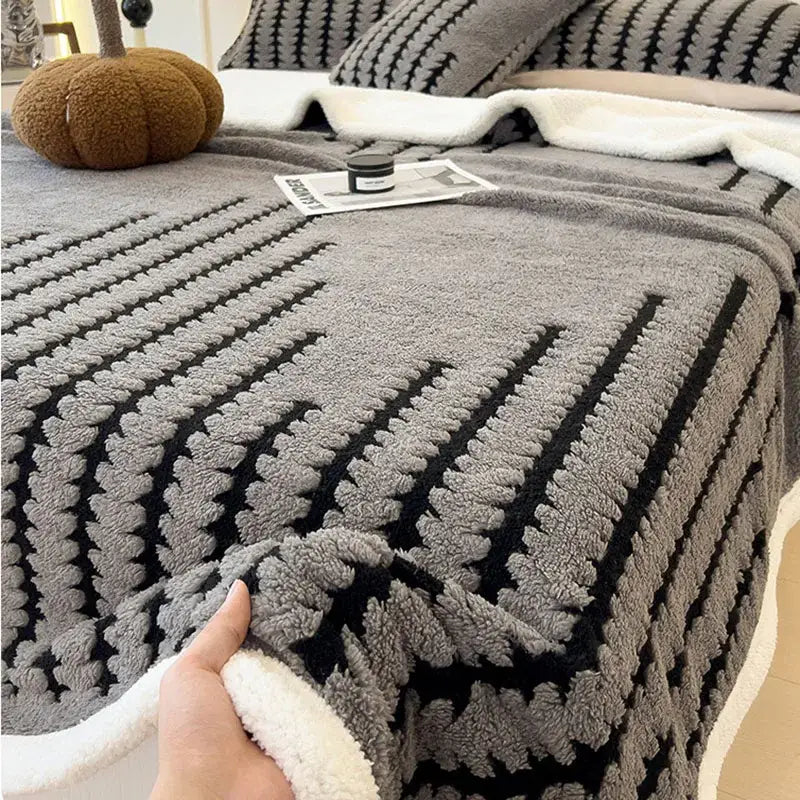 Gray and black textured decorbites jacquard blanket with thick lamb wool and plush cozy appearance for living room use
