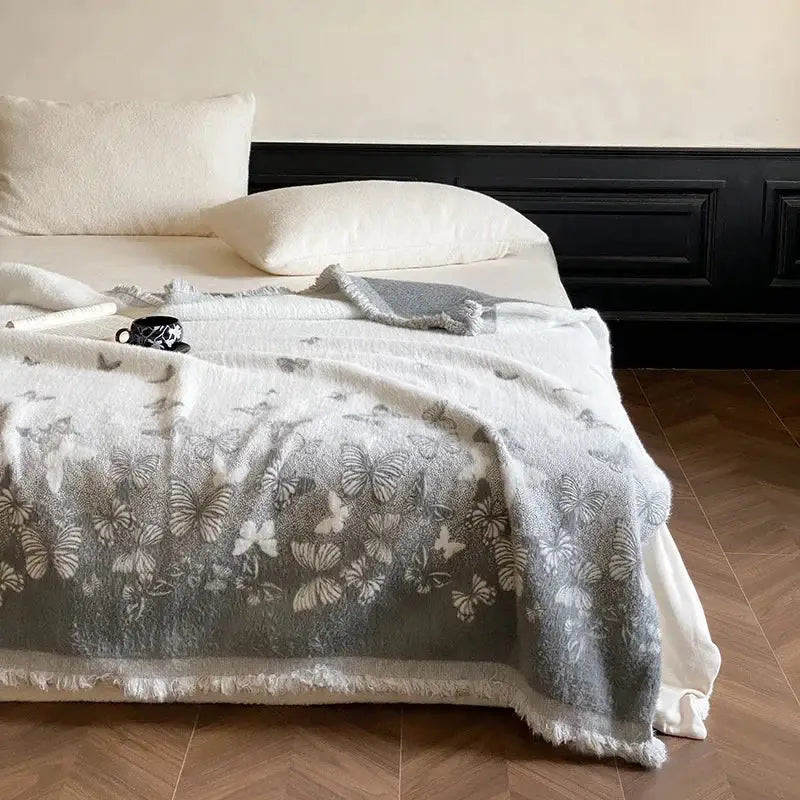 Soft gray bedroom throw blanket with butterfly jacquard imitation mink fur and frayed edges by decorbites